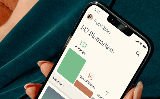 A smartphone showcases the Function Health app screen with "147 Biomarkers," where 131 are in range, 16 are out of range, and 7 have improved.